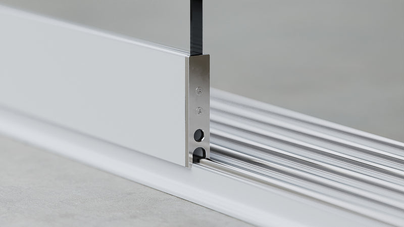 Onderprofiel met loopwielen voor glazen schuifwand